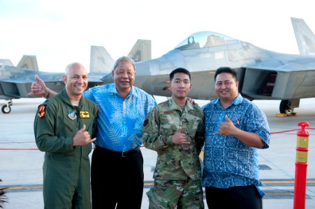 David Apatang Standing with USAF Airmen photo