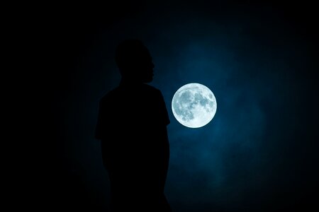 Illuminated light black moon photo