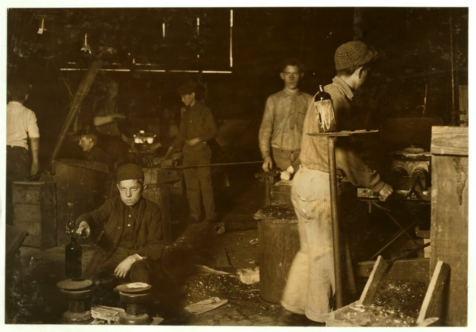 Day scene in New Jersey Glass House. Boy is Howard --, 15 years old but has been in the glass works for two years, and has worked some at night. LOC nclc.05447