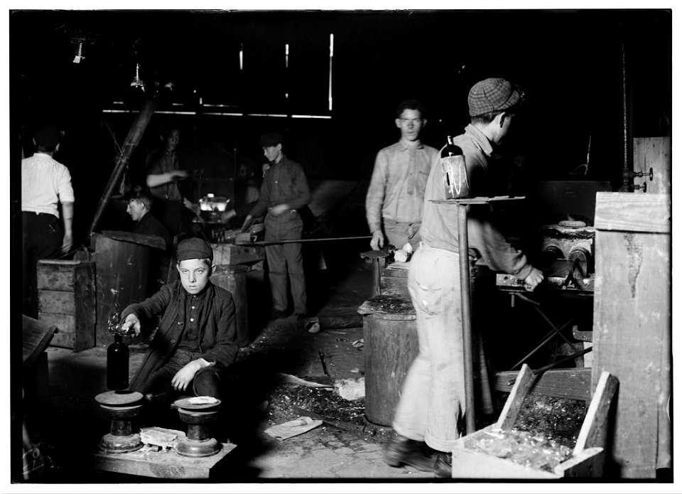 Day scene in New Jersey Glass House. Boy is Howard --, 15 years old but has been in the glass works for two years, and has worked some at night. LOC nclc.05447