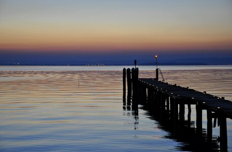 Jetty reflection on the lake photo