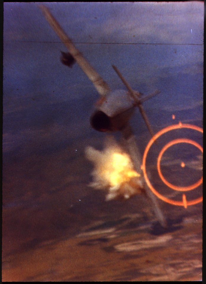 Death of a MIG. Firing his 20mm cannon at point-blank range, Major Kuster hits the left wing of the MIG near the... - NARA - 542338