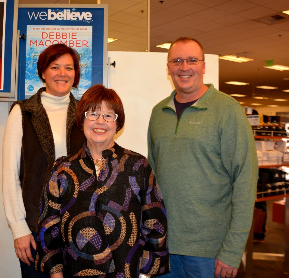 Debbie Macomber with Patty and Alan Schrader 161203-N-SP496-003