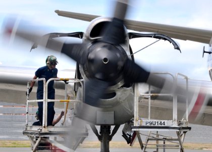 Defense.gov News Photo 100723-N-6855K-154 - U.S. Navy Petty Officer 3rd Class Alfred Barreta of Patrol Squadron 40 inspects the engine compartment of a P-3C Orion aircraft for leaks in