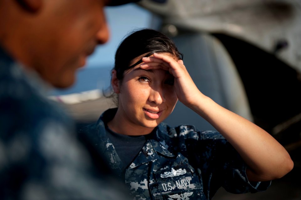 Defense.gov News Photo 100623-N-5319A-001 - U.S. Navy Chief Master-at-Arms Gerard left talks to Petty Officer 1st Class Garnet Valenzuela on the flight deck of the transport dock ship USS New