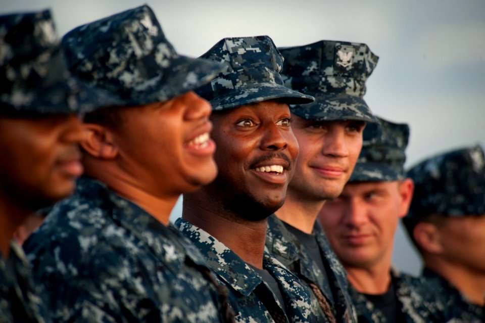 Defense.gov News Photo 100809-N-5319A-012 - U.S. Navy Seaman Jan Lane 3rd from left stands in ranks during a re-enlistment ceremony on the forecastle of the USS New Orleans LPD 18 off the