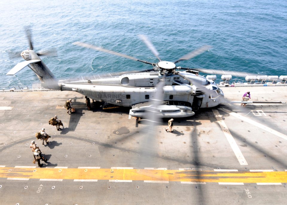 Defense.gov News Photo 100812-N-3729D-022 - U.S. Marines board an MH-53E Sea Dragon helicopter assigned to Helicopter Mine Countermeasure Squadron 15 aboard the USS Peleliu LHA 5 while