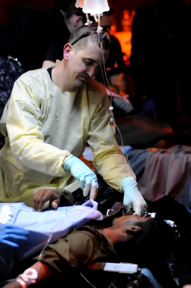 Defense.gov News Photo 100818-N-8907D-163 - U.S. Navy Petty Officer 2nd Class Justin Lamb a hospital corpsman assigned to the medical department aboard the aircraft carrier USS Harry S