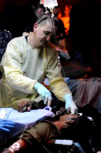 Defense.gov News Photo 100818-N-8907D-163 - U.S. Navy Petty Officer 2nd Class Justin Lamb a hospital corpsman assigned to the medical department aboard the aircraft carrier USS Harry S