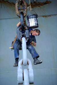Defense.gov News Photo 100823-N-9964S-159 - U.S. Navy Boatswain s Mate Jacklyn Cravey paints the anchor of the amphibious assault ship USS Iwo Jima LHD 7 in Limon Costa Rica on Aug. 23