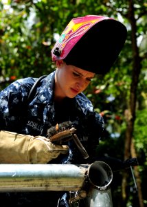Defense.gov News Photo 100827-N-1531D-310 - U.S. Navy Petty Officer 3rd Class Yanina Schiller a hull maintenance technician assigned to the multipurpose amphibious assault ship USS Iwo Jima