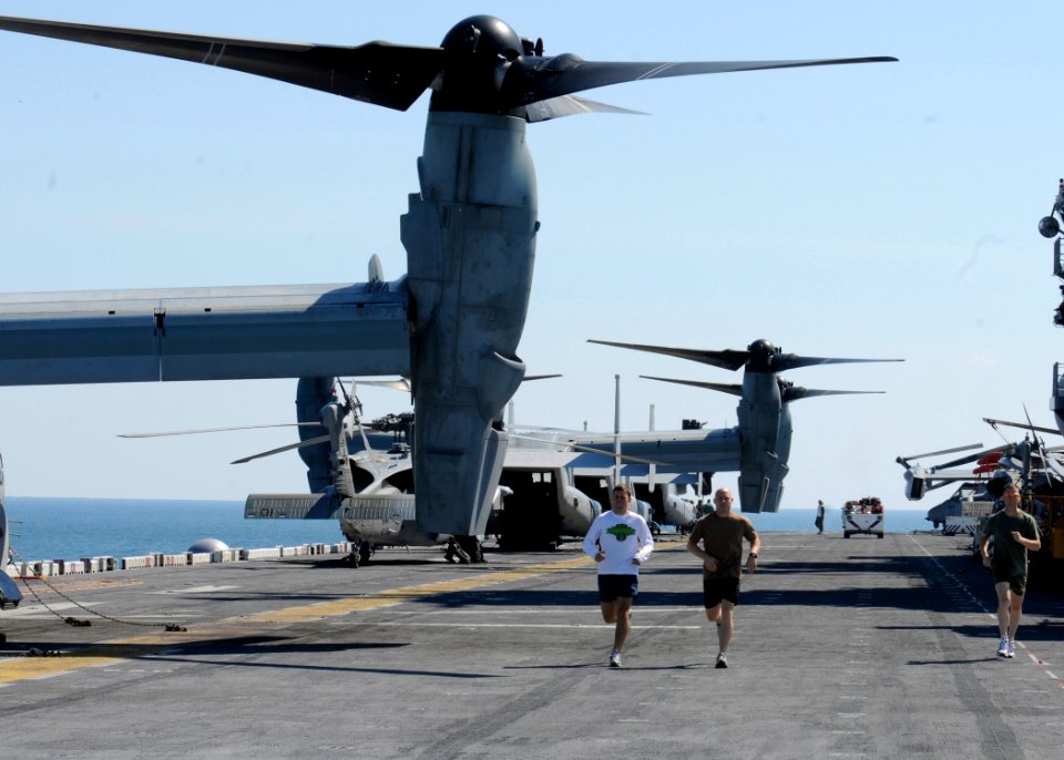 Defense.gov News Photo 100829-N-3154P-028 - U.S. Marines run on the flight deck aboard the amphibious assault ship USS Kearsarge LHD 3 on Aug. 29 2010. The Kearsarge is en route to Pakistan