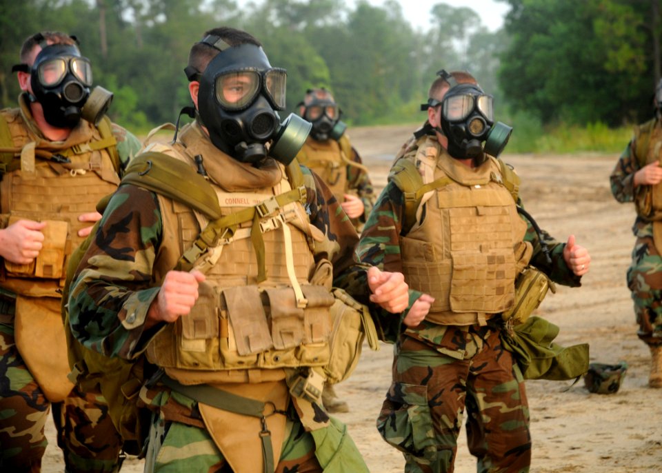Defense.gov News Photo 100806-N-9564W-089 - U.S. Navy sailors assigned to Naval Mobile Construction Battalion 74 run in place in full gear during a battalion readiness exercise at Naval