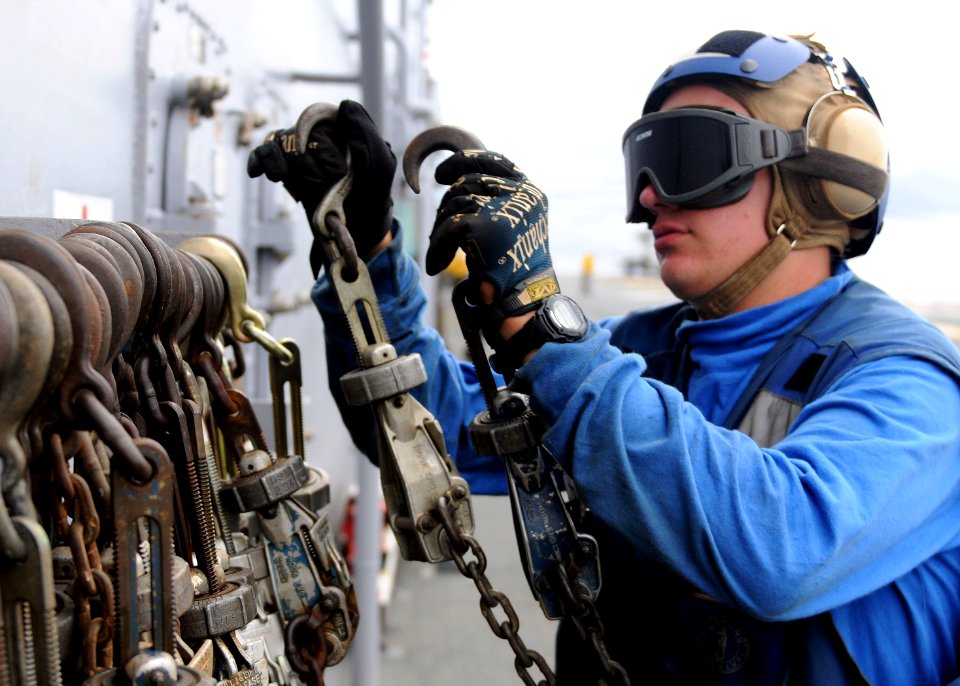 Defense.gov News Photo 100913-N-5538K-213 - U.S. Navy Airman Recruit Jeremy J. New stows tie-down chains after removing them from a CH-46E Sea Knight helicopter aboard the USS Essex LHD 2 in