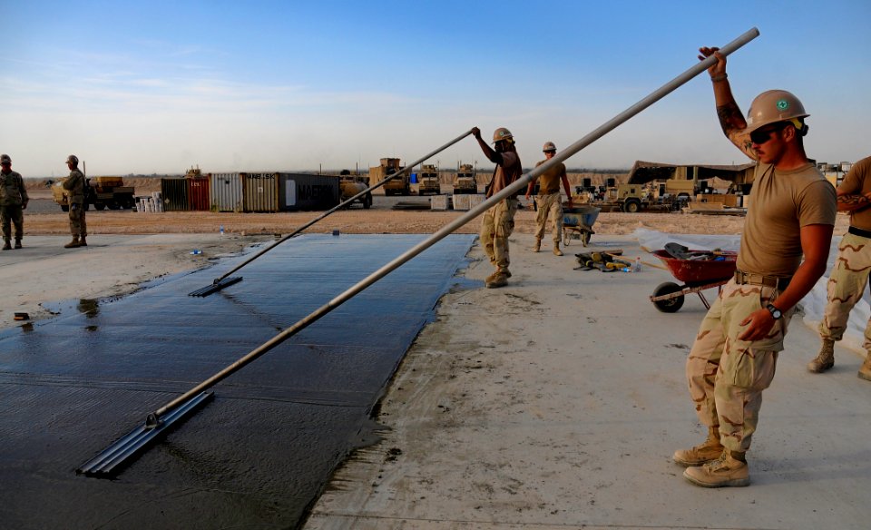 Defense.gov News Photo 100925-N-6436W-021 - U.S. Navy Seabees with Naval Mobile Construction Battalion 40 lay concrete for a project at Camp Deh Dadi II in northern Afghanistan on Sept. 25
