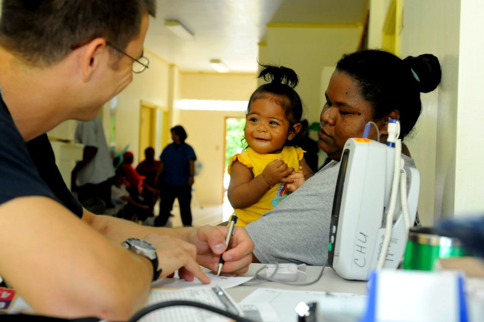 Defense.gov News Photo 100728-N-7280V-355 - U.S. Navy Ensign Neil Petersen assigned to U.S. Naval Hospital Guam records vitals for a toddler patient at the Southern Community Health Center