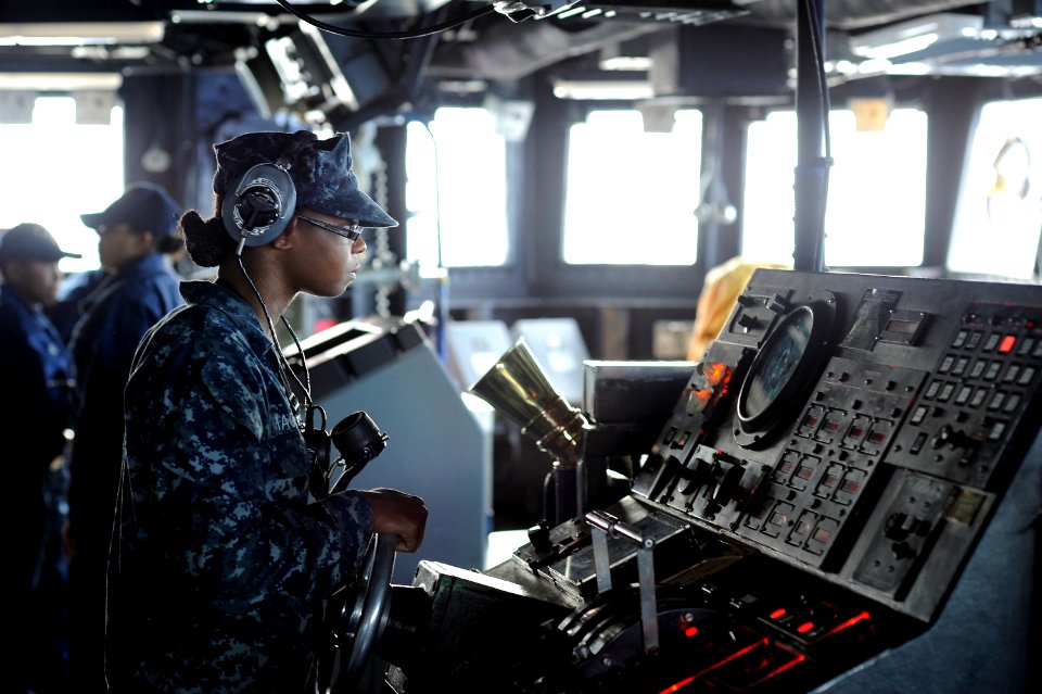 Defense.gov News Photo 101007-N-8335D-006 - U.S. Navy Seaman Rachel Mackey steers the amphibious dock landing ship USS Harpers Ferry LSD 49 through the Philippine Sea while forward deployed