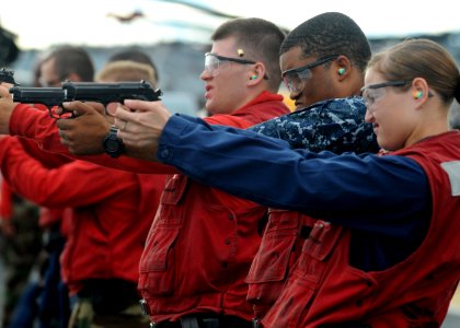 Defense.gov News Photo 100913-N-4743B-134 - U.S. Navy sailors aboard the amphibious assault ship USS Essex LHD 2 fire 9 mm Beretta pistols during a small arms shoot in the Philippine Sea on