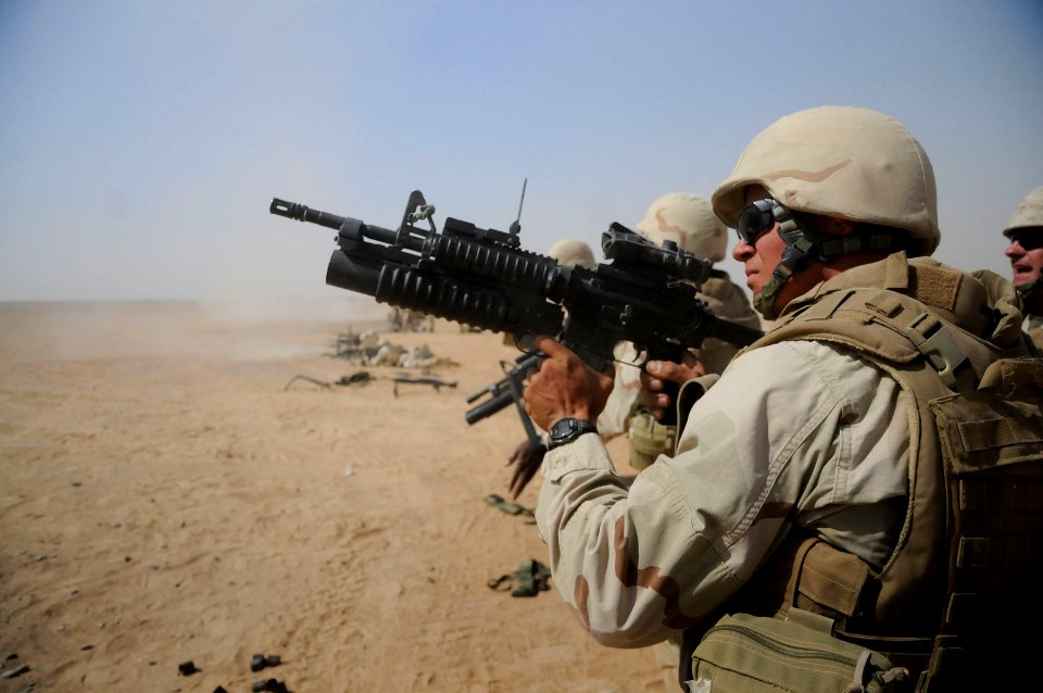 Defense.gov News Photo 101016-N-0475R-992 - U.S. Navy Petty Officer 3rd Class Jesus Bridges a Seabee with Naval Mobile Construction Battalion 5 fires an M203 grenade launcher during a