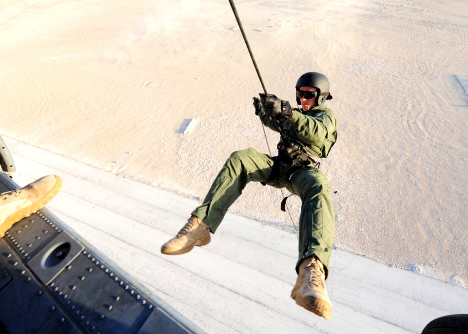 Defense.gov News Photo 101020-N-3415O-300 - U.S. Navy Petty Officer 2nd Class Michael Reedy assigned to Mobile Diving and Salvage Unit 2 rappels from an SH-60 Seahawk helicopter during a