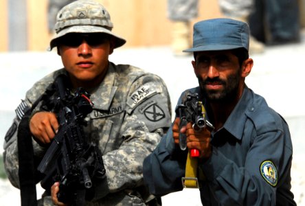 Defense.gov News Photo 100828-N-6538W-076 - U.S. Army Pfc. Alejandro Orona assists Afghan National Police during training at the Afghan police headquarters in Charreh Dera Afghanistan on Aug