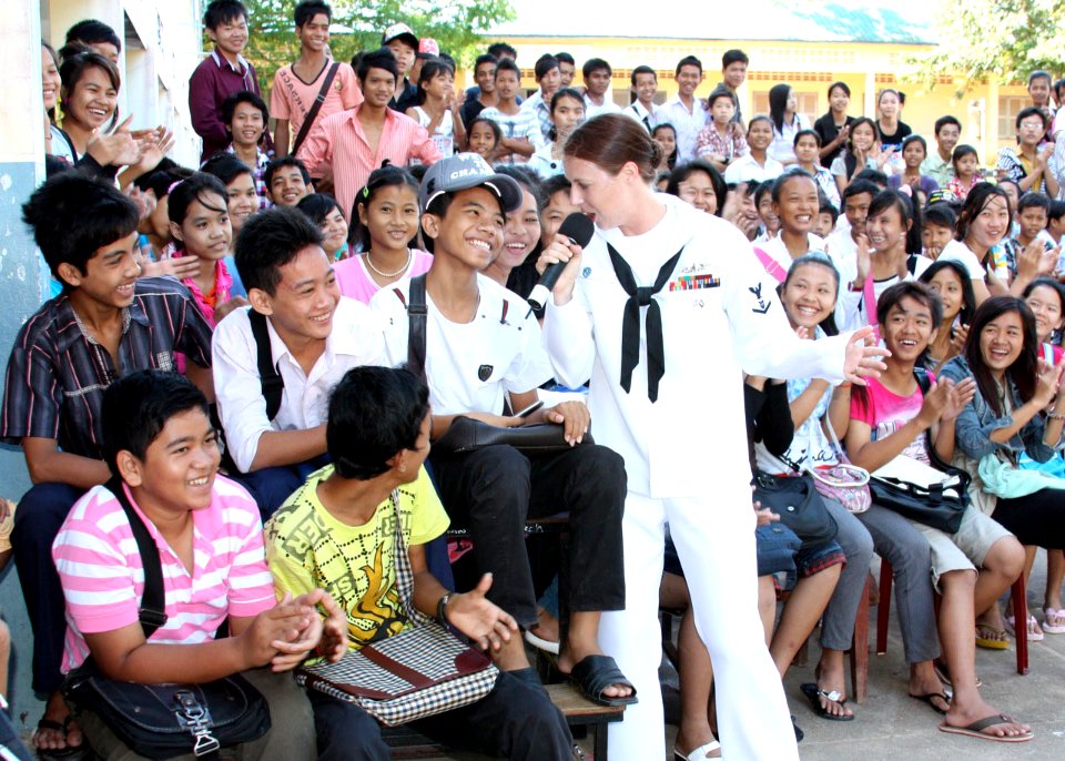 Defense.gov News Photo 101029-N-5773W-684 - U.S. Navy Petty Officer 3rd Class Nina Church center sings to students at a high school in Sihanoukville Cambodia on Oct. 29 2010. Church is
