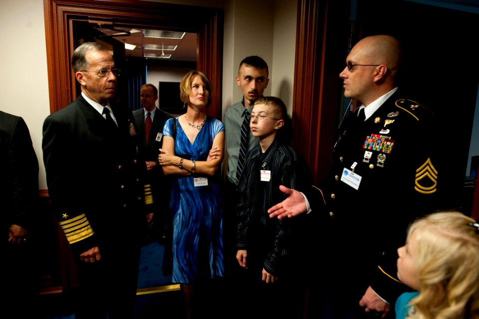 Defense.gov News Photo 101028-N-0696M-019 - Chairman of the Joint Chiefs of Staff Adm. Mike Mullen U.S. Navy speaks with the family of U.S. Army Sgt. 1st Class William Frass at the premiere