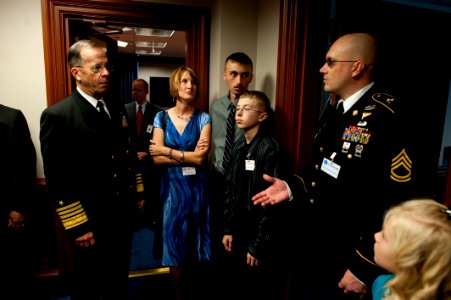 Defense.gov News Photo 101028-N-0696M-019 - Chairman of the Joint Chiefs of Staff Adm. Mike Mullen U.S. Navy speaks with the family of U.S. Army Sgt. 1st Class William Frass at the premiere