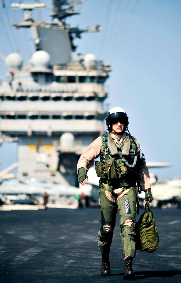 Defense.gov News Photo 101109-N-6003P-236 - U.S. Marine Corps Capt. William Paxton a pilot assigned to Marine Fighter Attack Squadron 312 walks to his aircraft prior to morning flight