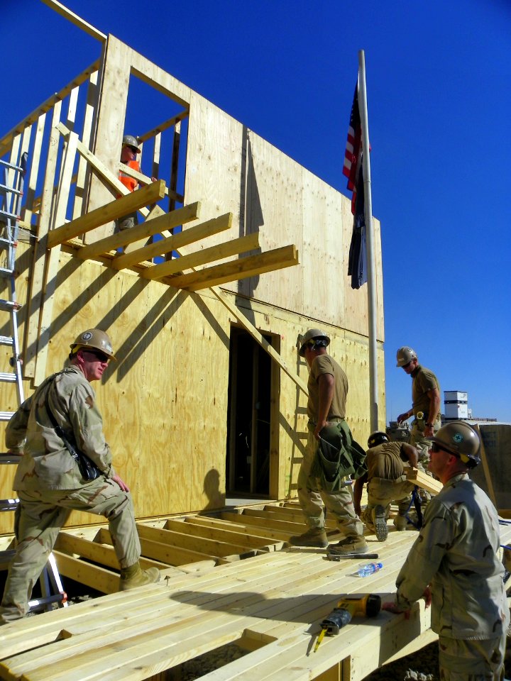 Defense.gov News Photo 101112-N-7743H-024 - Capt. John DeBerard commanding officer of Naval Mobile Construction Battalion 18 and Chief Petty Officer Joseph Zaleski confer about safety as