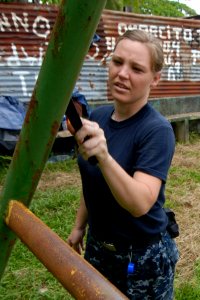 Defense.gov News Photo 100920-N-7680E-037 - U.S. Navy Petty Officer 2nd Class Alicia Williamson embarked aboard the multipurpose amphibious assault ship USS Iwo Jima LHD 7 removes rust