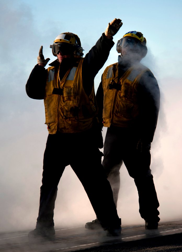 Defense.gov News Photo 101201-N-7981E-255 - U.S. Navy Petty Officer 2nd Class Jathan Lane left an aircraft director assigned to V-1 Division of the air department aboard the aircraft