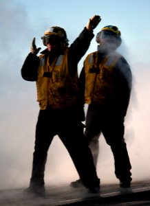 Defense.gov News Photo 101201-N-7981E-255 - U.S. Navy Petty Officer 2nd Class Jathan Lane left an aircraft director assigned to V-1 Division of the air department aboard the aircraft