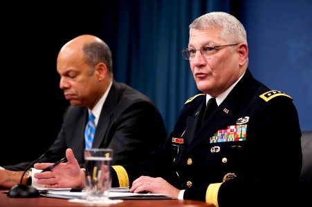 Defense.gov News Photo 101130-N-0696M-119 - Department of Defense General Counsel Jeh C. Johnson and U.S. Army Gen. Carter Ham conduct a press briefing in the Pentagon discussing the public