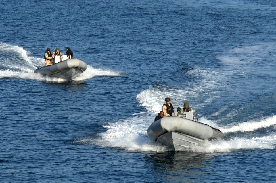 Defense.gov News Photo 101011-N-2855B-112 - U.S. Navy sailors with the visit board search and seizure team aboard the guided-missile destroyer USS Stout DDG 55 speed through the