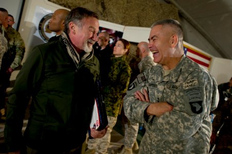 Defense.gov News Photo 101215-N-0696M-193 - Comedian Robin Williams visits with Commanding General of Combined Task Force 101 U.S. Army Lt. Gen. John F. Campbell after the USO Holiday Tour