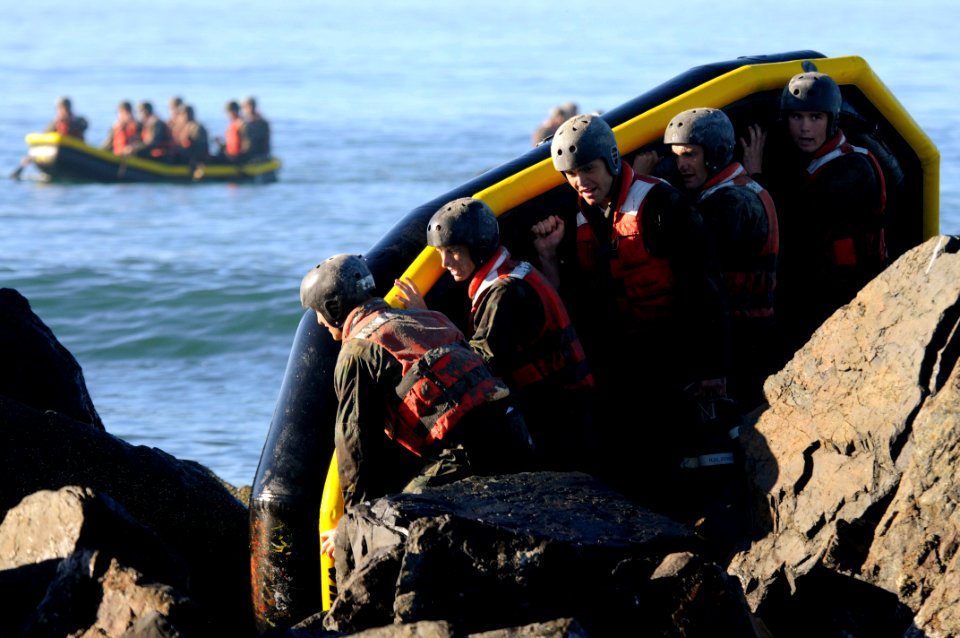 Defense.gov News Photo 101102-N-7883G-133 - U.S. Navy SEAL candidates from Basic Underwater Demolition SEAL BUD S class 286 participate in a rock portage exercise at the Naval Special Warfare photo