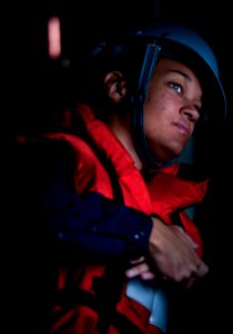 Defense.gov News Photo 110104-N-2055M-137 - Seaman Kristen Grund observes sailors in a refueling station aboard the aircraft carrier USS Carl Vinson CVN 70 during a refueling at sea underway