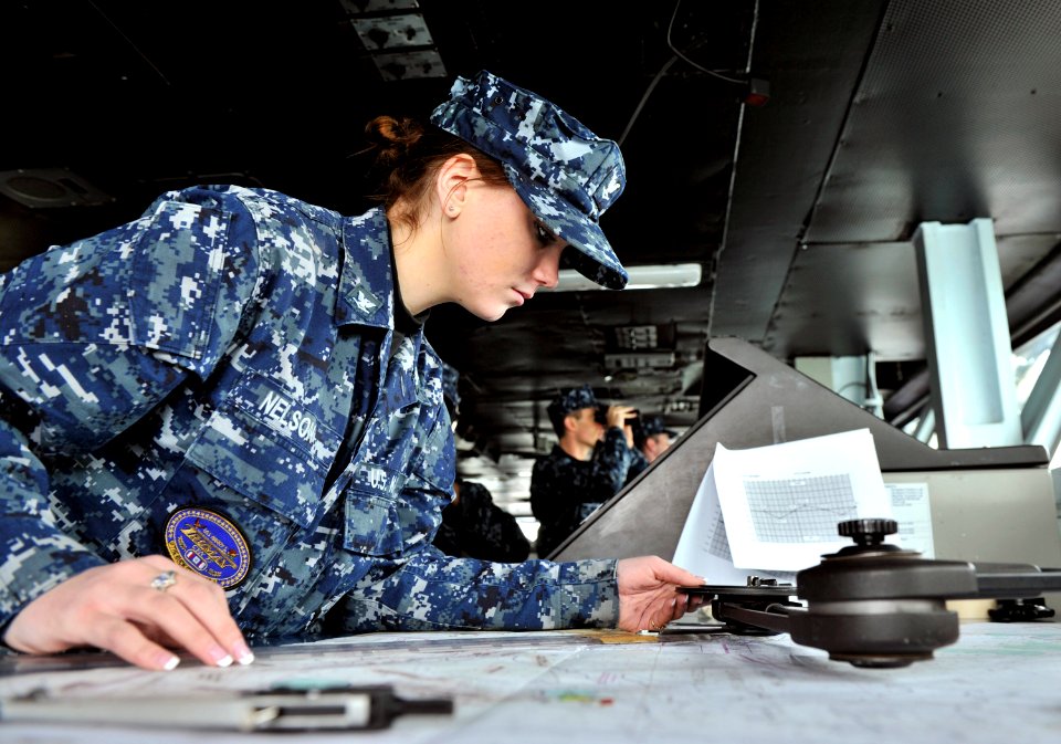 Defense.gov News Photo 110127-N-6003P-027 - Petty Officer 3rd Class Sarah Nelson uses a parallel motion protractor to plot the position of the aircraft carrier USS Harry S. Truman CVN 75 as
