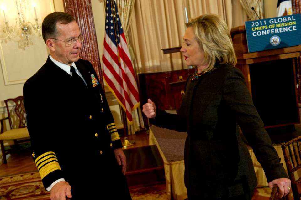 Defense.gov News Photo 110202-N-0696M-016 - Chairman of the Joint Chiefs of Staff Adm. Mike Mullen U.S. Navy speaks with Secretary of State Hillary Clinton prior to delivering remarks at