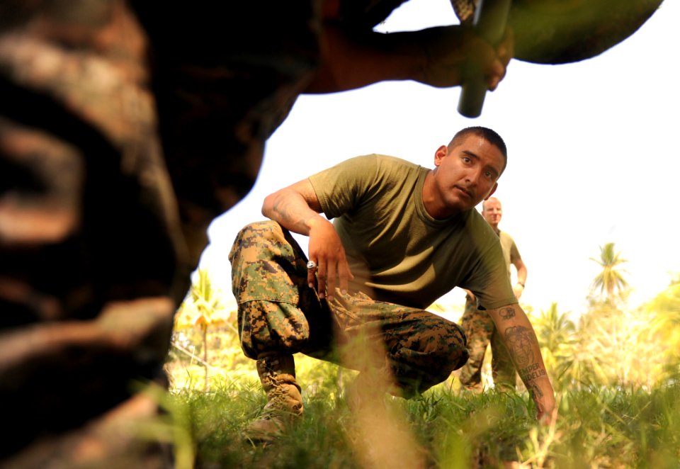 Defense.gov News Photo 110125-N-2984R-692 - U.S. Marine Corps Gunnery Sgt. Joe Urias 2nd from left observes as Guatemalan marines perform takedown techniques in San Jose Guatemala during a