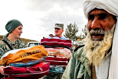 Defense.gov News Photo 110202-N-2142H-001 - U.S. forces help distribute blankets coats wool caps and scarves to local village elders in Shindand in Afghanistan s Herat province on Feb. 2
