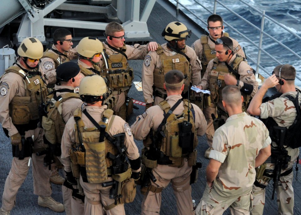 Defense.gov News Photo 110101-N-3415O-032 - U.S. Navy sailors assigned to a visit board search and seizure team and Coast Guardsmen assigned to the Coast Guard Law Enforcement Detachment