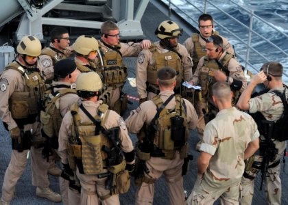 Defense.gov News Photo 110101-N-3415O-032 - U.S. Navy sailors assigned to a visit board search and seizure team and Coast Guardsmen assigned to the Coast Guard Law Enforcement Detachment
