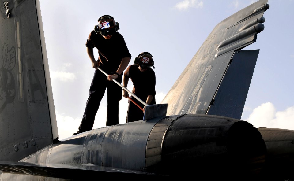 Defense.gov News Photo 110211-N-7488A-084 - Airman Recruit Teddy Frisby left and Airman Apprentice Kevin Dwyer both assigned to Strike Fighter Squadron 113 wash an F A-18C Hornet on the