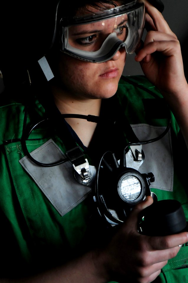 Defense.gov News Photo 110107-N-9132C-321 - Seaman Autumn Hicks from Denison Texas performs the duties of the fuel station phone talker during a replenishment at sea aboard the aircraft