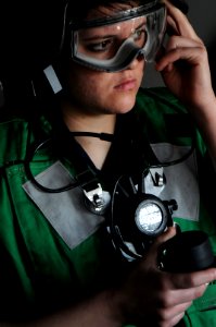 Defense.gov News Photo 110107-N-9132C-321 - Seaman Autumn Hicks from Denison Texas performs the duties of the fuel station phone talker during a replenishment at sea aboard the aircraft