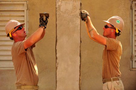 Defense.gov News Photo 110112-N-1755G-129 - U.S. Navy Petty Officer Robert DeLuca left and Petty Officer Naethan Clark both assigned to Naval Mobile Construction Battalion 74 Detail Horn of photo