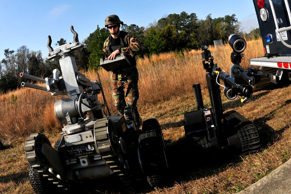 Defense.gov News Photo 110224-N-YR391-002 - Chief Petty Officer Rich Mcave assigned to Explosive Ordnance Disposal Mobile Unit 6 operates a Talon robot and a Remote Ordnance Neutralization