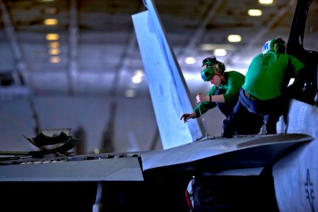 Defense.gov News Photo 110224-N-2055M-235 - U.S. Navy Petty Officer 3rd Class Jessica Murphy assigned to Strike Fighter Squadron 22 performs maintenance on an F A-18F Super Hornet aircraft